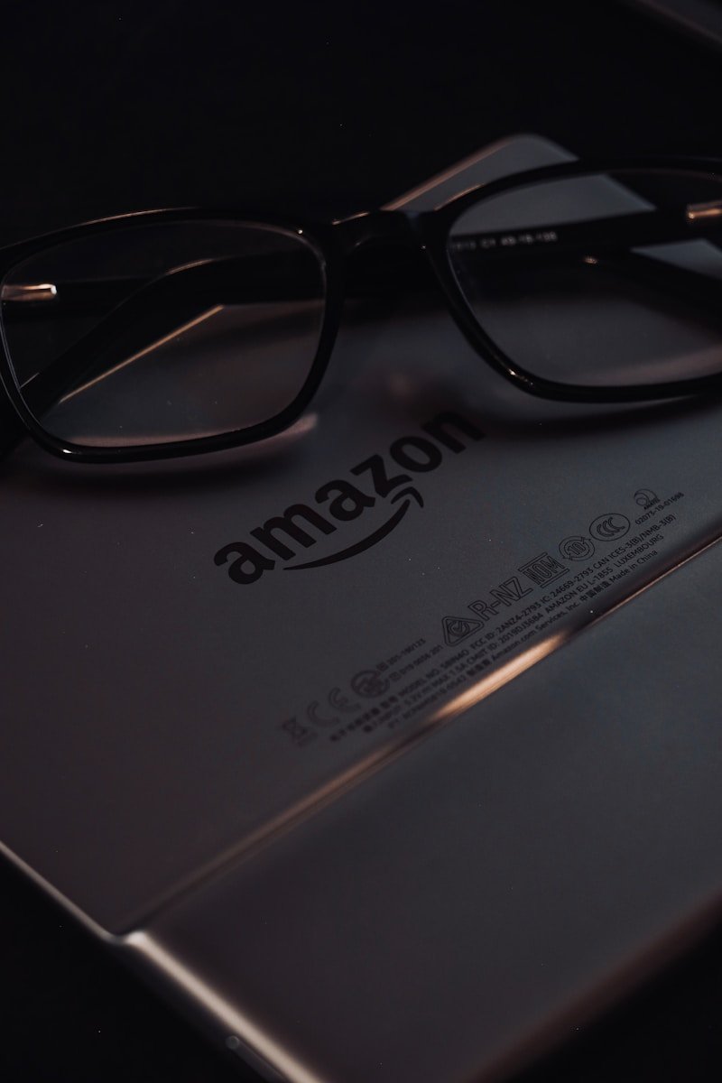 a pair of glasses sitting on top of a book